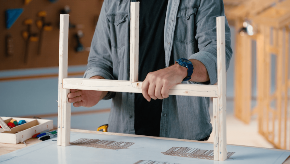 Miniature model of the top of a door frame, made out of plywood