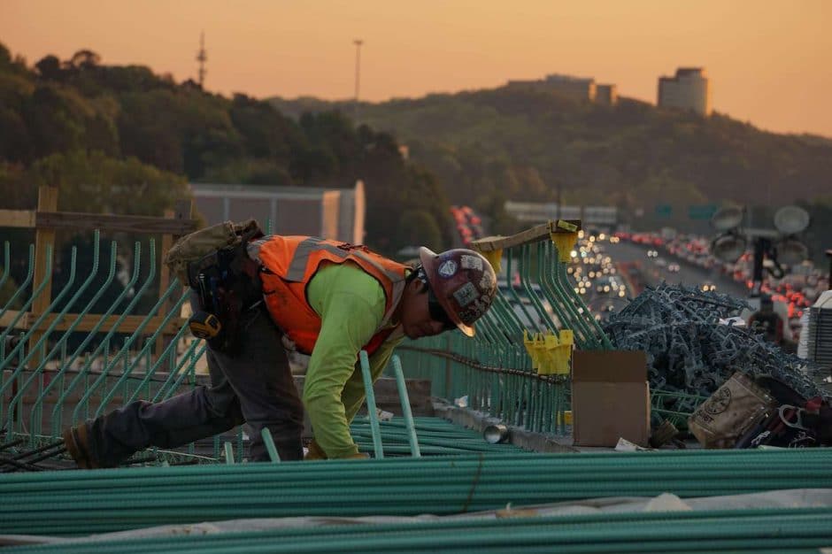 Construction worker alone on roof