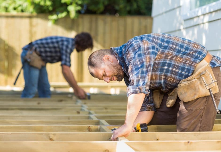 Construction worker working on deck beams