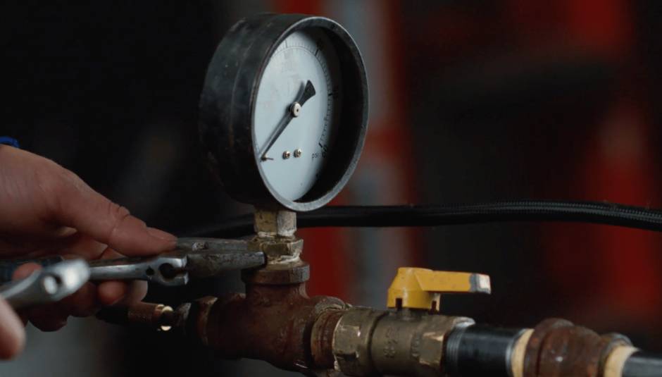 Close-up of hydrostatic pump pressure gauge