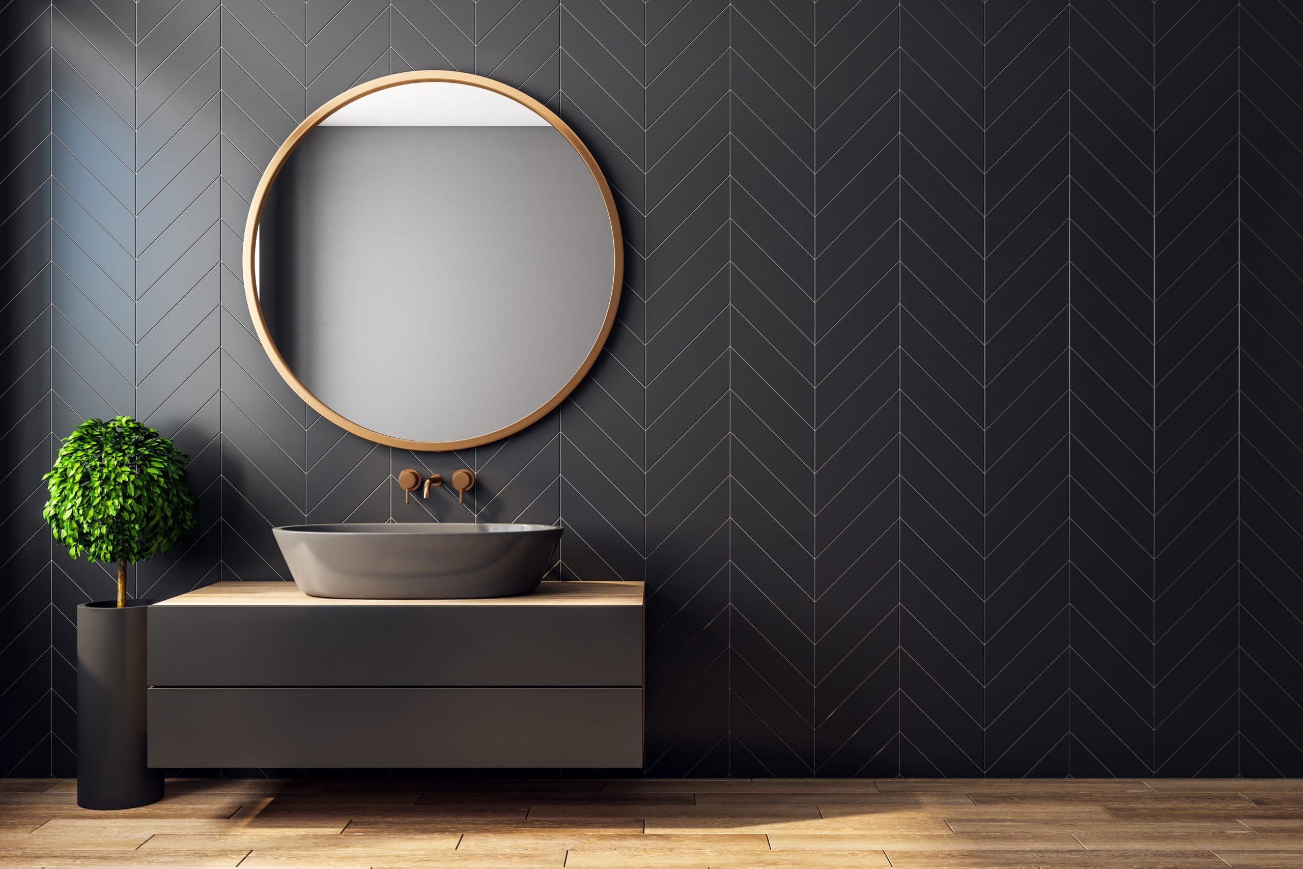 Modern black bathroom interior with chevron tile wall