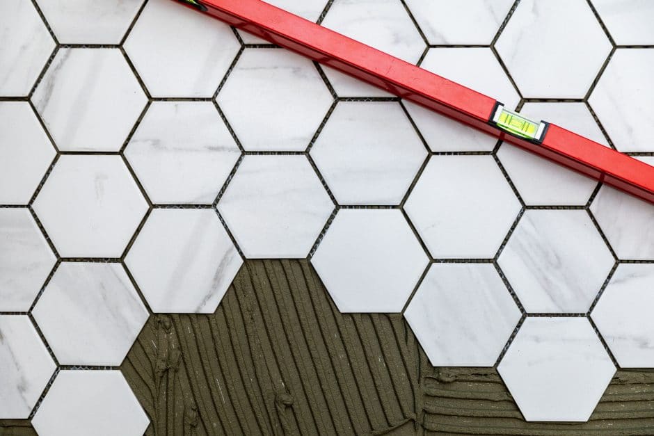 Laying marble texture hexagon tiles on the floor